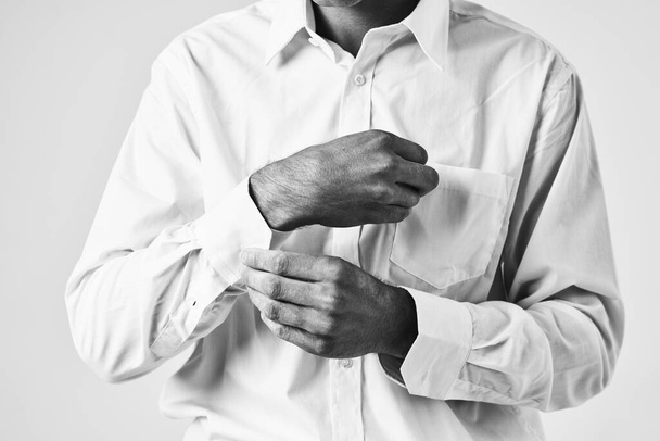 man buttoning up his shirt sleeve elegant style self-confidence - Fotoğraf, Görsel