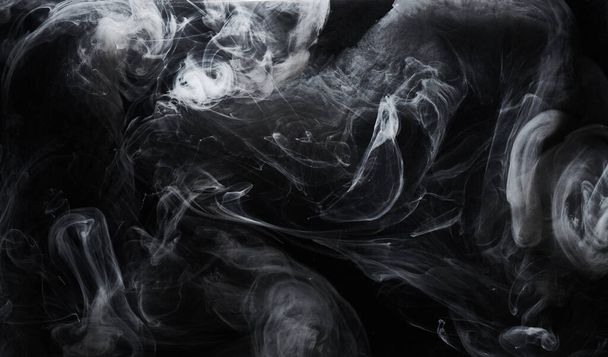 Abstract dark paint in water background. White smoke cloud motion on black, acrylic ink swirl splashes - Фото, зображення