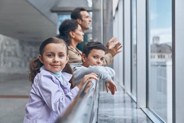 Family with two little kids waiting for their flight at the airport terminal - Φωτογραφία, εικόνα