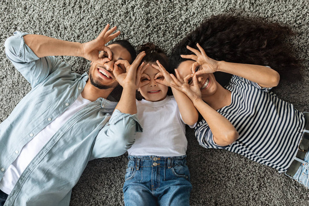 Arabic family of three having fun together at home - Photo, Image