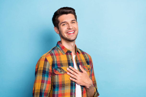 Portrait of attractive cheerful pleased calm guy good mood news isolated over bright blue color background - Foto, Imagen