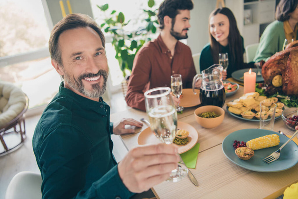 Portrait of adorable cheerful family eating homemade dish celebrating festal occasion event party at home indoors - Fotoğraf, Görsel