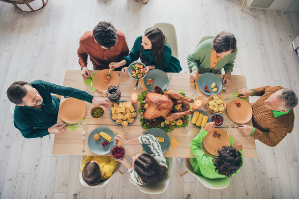 Top above high angle view portrait of adorable cheery careful family eating homemade dish meat autumn fall at home indoors - Fotografie, Obrázek