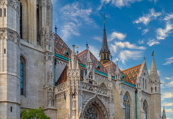 BUDAPEST, HUNGARY - AUGUST 22, 2021: Detail of Matthias Church, near Fisherman Bastion and Buda castle. A fourteenth-century church named after King Matthew Corvin who married here. - Фото, изображение