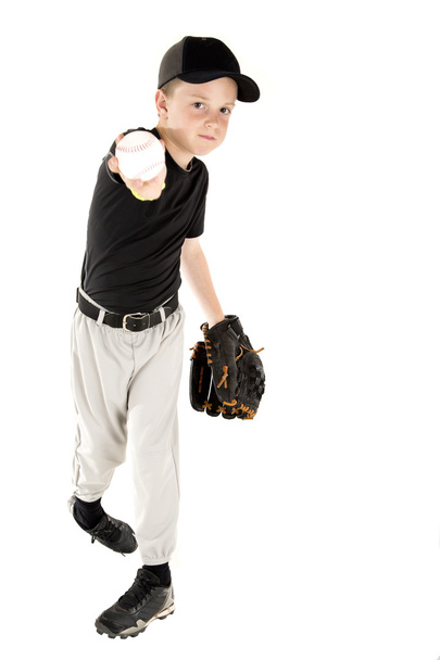 Young baseball player throwing the ball into the camera - Foto, imagen