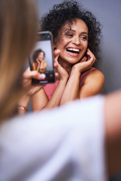Joyful female person demonstrating her nice makeup - Foto, Imagen