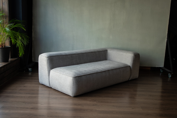 soft upholstered light sofa with modules in the interior with a panoramic window - Foto, imagen