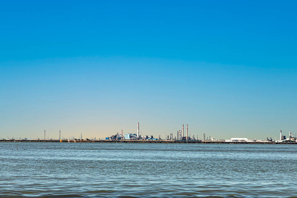 industry area at the horizon in lagoon of Venice seen from motorboat way to venice, Italy - Foto, immagini