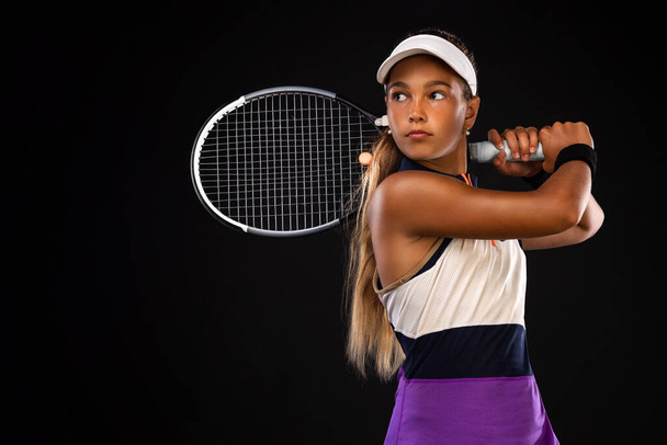 Tennis player. Beautiful girl teenager and athlete with racket in pink sporswear and hat on tennis court. Fashion and sport concept. - Zdjęcie, obraz