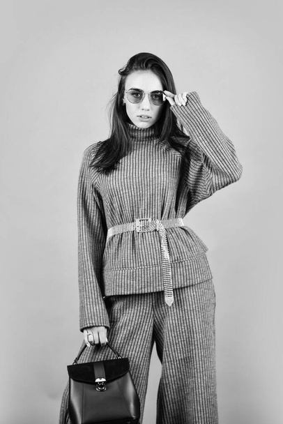 Fashionable knitwear. Designed for your comfort. Warm comfortable clothes. Casual style for every day. Knitwear concept. Feel comfortable. Woman wear grey suit blouse and pants. Shop Your Style - 写真・画像