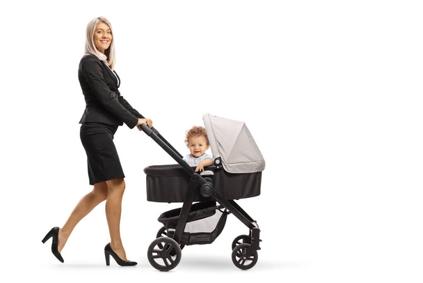 Full length shot of a businesswoman pushing a baby stroller isolated on white background - Fotoğraf, Görsel