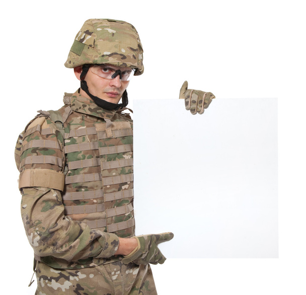 Modern soldier holding a poster - Zdjęcie, obraz