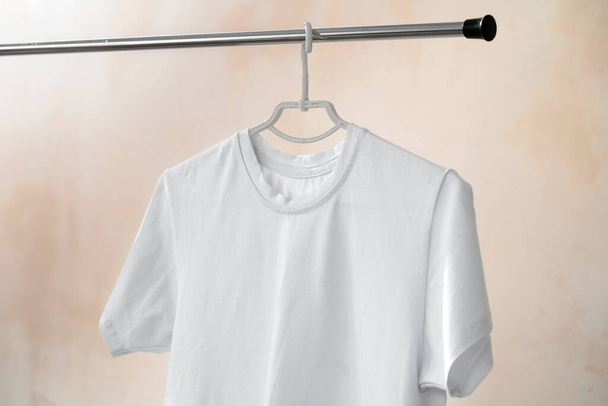 Plain white cotton t-shirt on hanger for your design - Fotó, kép