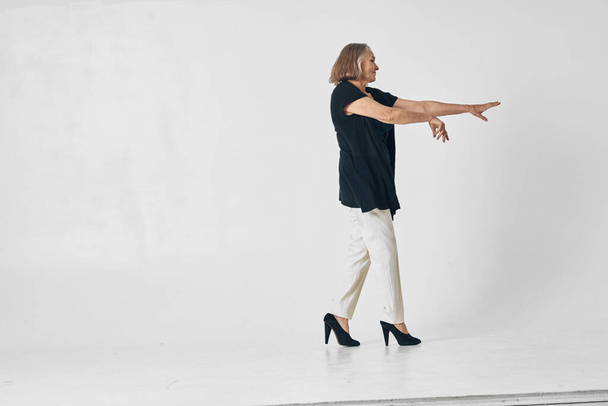 elderly woman dance fashion posing isolated background - Zdjęcie, obraz