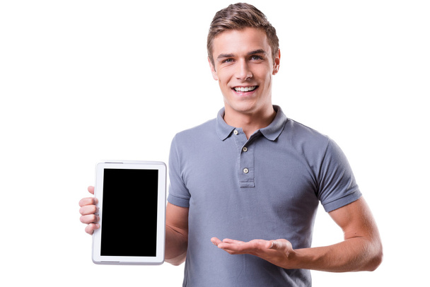Young man holding digital tablet - Фото, изображение