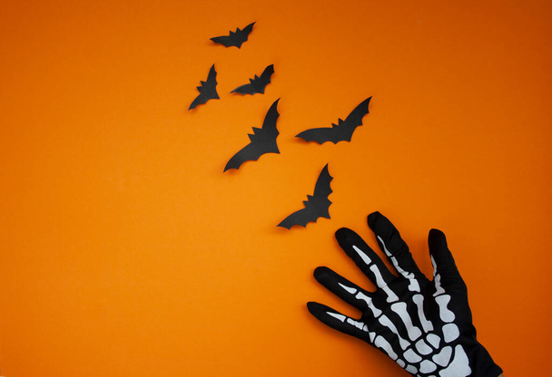 Halloween holiday, the hand is catching bats. View from above. - Photo, image