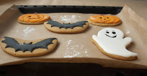 Halloween party, cookies with pumpkin, ghost, bat icing. Handmade in the bakery. - Foto, immagini