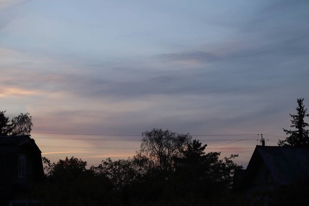 view you can only get on the countryside - beautiful sunset view from the village house roof - Zdjęcie, obraz