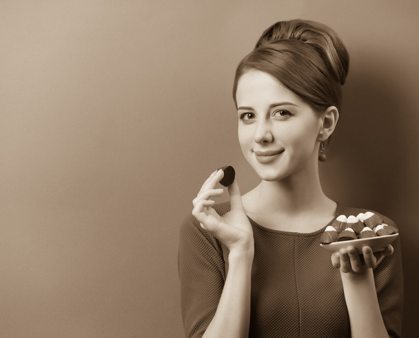 Women with candy. Photo in sepia color image style. - Photo, Image