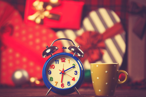 Vintage clock and cup of coffee on christmas background - Photo, Image