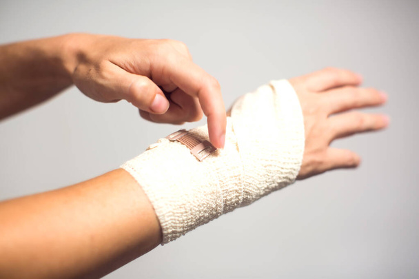 Elastic bandage on hand. Healthcare and medicine concept - Foto, imagen