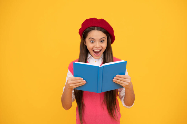 unbelievable. back to school. surprised kid in beret ready to study. amazed child reading book. - Zdjęcie, obraz