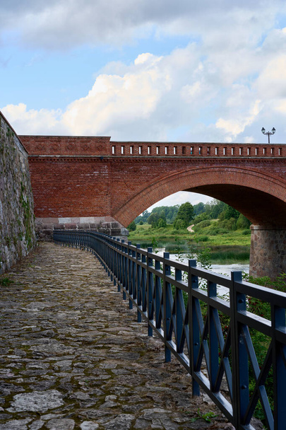                                Pathway to the bridge made of red brick - Photo, Image