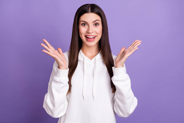 Photo of young amazed shocked happy woman raise hands good mood enjoy isolated on purple color background - Foto, afbeelding