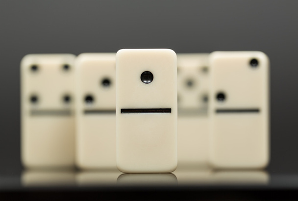 White dominoes showing leader or winner - Photo, Image