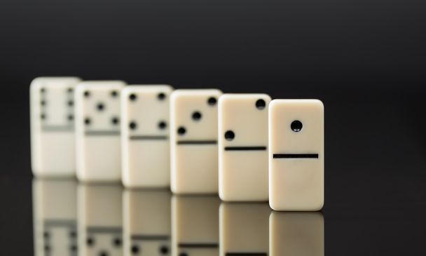 White dominoes showing leader or winner - Photo, Image