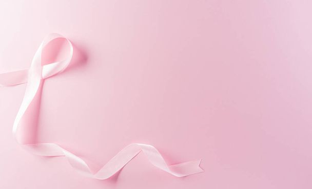 Pink ribbons on pastel background, Symbol of women's breast cancer awareness, Health care and medical concept. - Fotoğraf, Görsel
