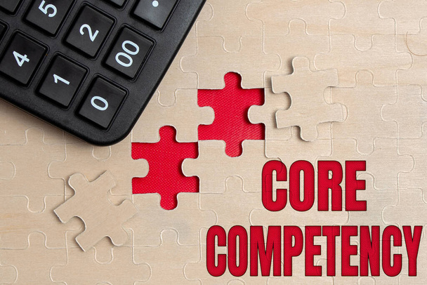 Sign displaying Core Competency. Concept meaning harmonized combination of multiple resources and skills Building An Unfinished White Jigsaw Pattern Puzzle With Missing Last Piece - Photo, Image