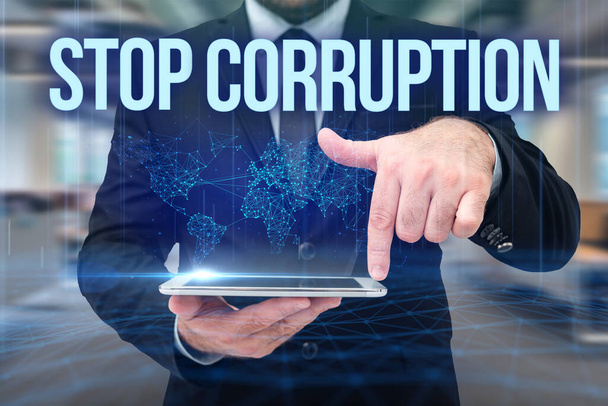 Conceptual display Stop Corruption. Business overview Put an end in abusing of entrusted power for private gain Man In Uniform Standing Holding Tablet Typing Futuristic Technologies. - Photo, Image