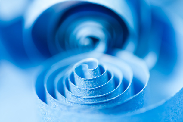 Macro, abstract, background picture of blue paper spirals on paper background - Photo, image