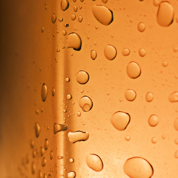 Fresh background of water drops on orange surface - Фото, зображення