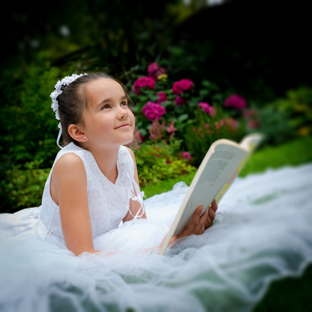 Girl reading First Holy Communion - Foto, imagen