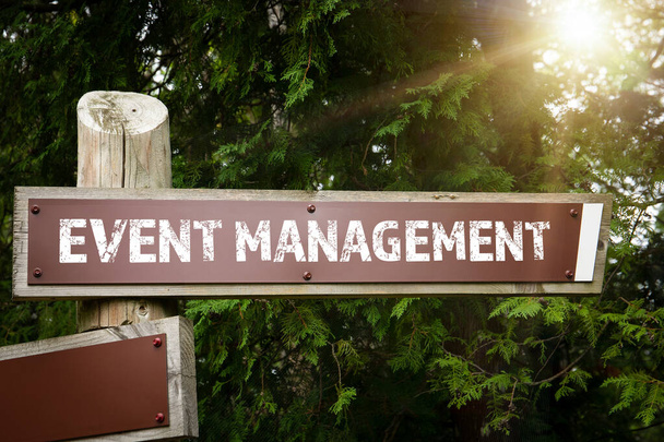 Event management concept. Road sign and arrow. Wooden construction - Photo, Image