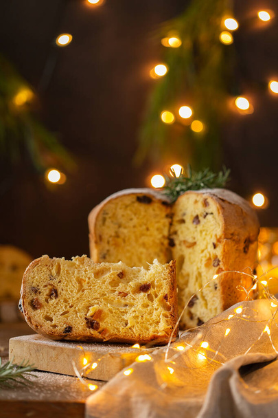 Traditional Italian Christmas cake Panettone with festive decorations  - Фото, изображение