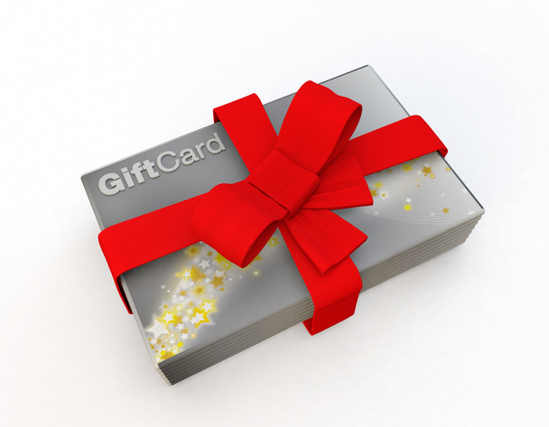 stack of silver gift cards wrapped in a red bow - 写真・画像