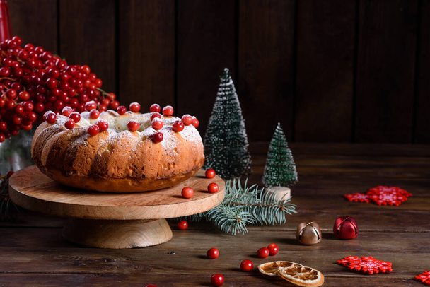 Christmas festive pound cake decorated with cranberries, view from above - Photo, Image