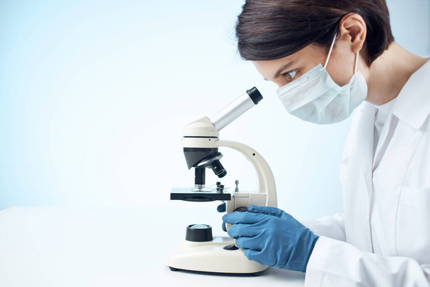 Woman in white coat microscope science work professionals - 写真・画像