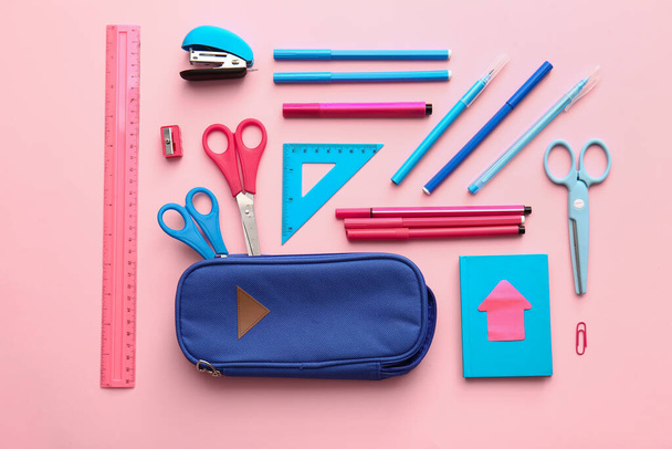 Composition with pencil case and stationery on color background - Photo, Image
