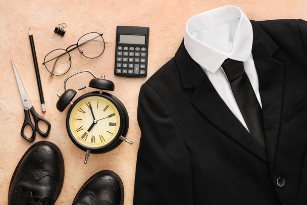 Stylish school uniform, shoes, eyeglasses, alarm clock and stationery on color background, closeup - Photo, Image