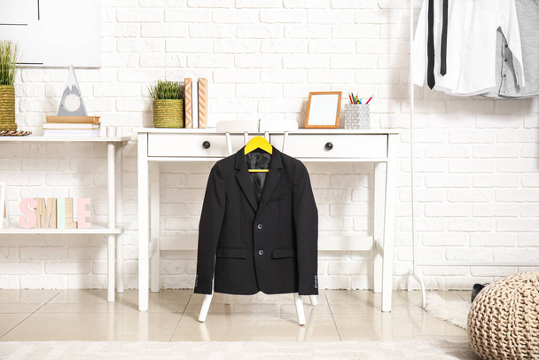 Modern workplace with school uniform in interior of room - Photo, Image