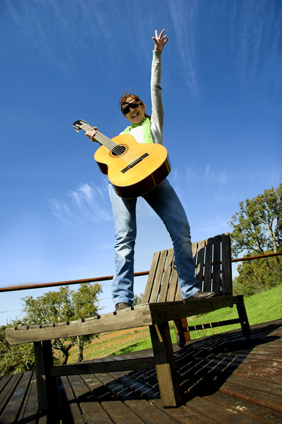 Woman with a guitar - Foto, afbeelding