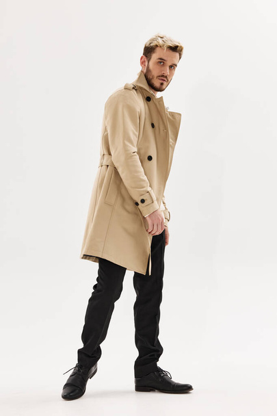 handsome man in coat fashion glamor studio full length - Photo, Image