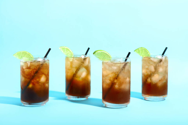 Glasses of tasty Long Island iced tea on color background - Photo, Image