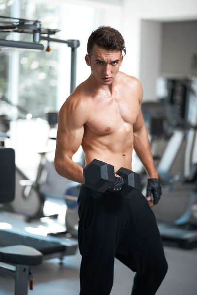man doing exercises dumbbell bicep muscles - Photo, image
