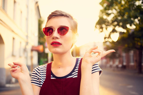 woman in sunglasses with short hair outdoors romance posing - Photo, Image