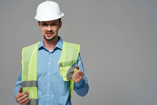 male builders protection Working profession light background - Foto, afbeelding